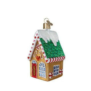 Cookie Cottage Ornament, glittery gingerbread house with green roof, white icing, and candy cane trim.