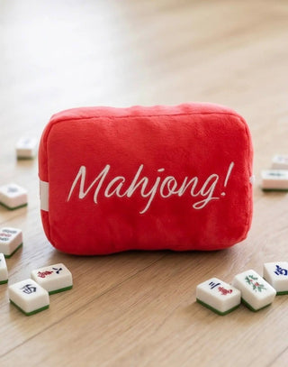 Muttjong Tile Plush dog toy, red plush cube with Mahjong-inspired text and squeaker inside