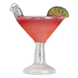 Cosmopolitan ornament, red cocktail with lime wedge garnish and sugar rim on a frosted stem.
