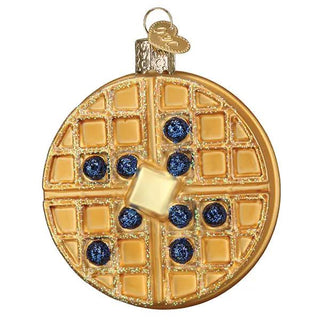 Waffle ornament, round gold-tone glass with grid pattern, glitter detailing and blue gem accents.