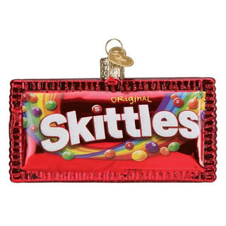 Skittles ornament in a red frame featuring a glossy candy wrapper design with colorful Skittles graphics