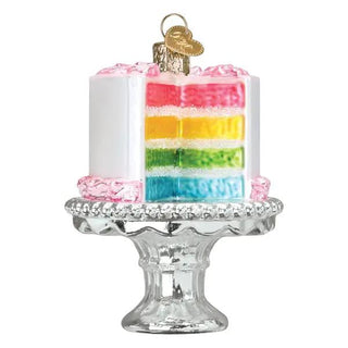 Cake On Stand Ornament with rainbow layered cake on a clear glass pedestal