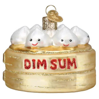 Dim Sum ornament: gold cake with five smiling white dumplings on top and red DIM SUM lettering.