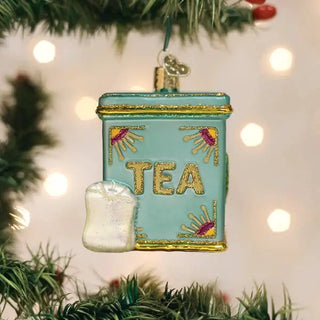 Tea Tin Ornament in teal with gold trim and a hanging tea bag charm