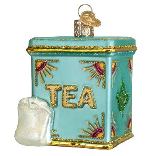 Tea tin ornament, turquoise tin with gold glitter trim and TEA lettering, sugar cube charm.