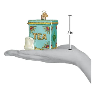 Tea Tin Ornament, turquoise tin with gold trim and TEA lettering, 3 in tall.