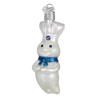 Doughboy ornament, white ceramic figure with chef hat and blue glittery scarf, silver glitter top, hanging loop.