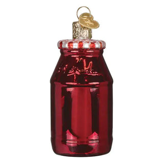 Strawberry jam ornament: red glass jar with a metallic cap.