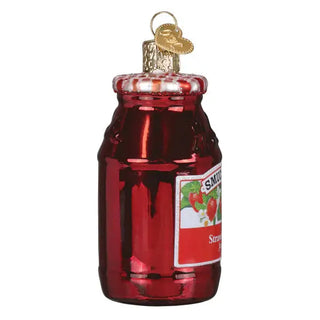Strawberry jam jar ornament in red glass with a gold cap and label visible.