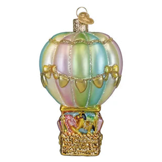 Baby Bear Balloon Ornament with pastel rainbow balloon and gold trim atop a decorative basket base.