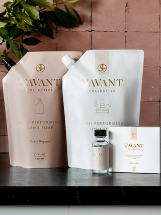 Two dish soap refill pouches in blush pink and white with bergamot scent, plus a small bottle and boxed set.