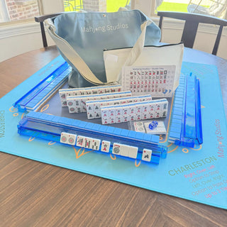 American Mahjong tile set, 166 tiles in blue and white, with blue racks and a light blue carry bag