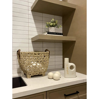 Laundry detergent Fresh Linen, white bottle with handle on the counter beside a woven basket