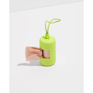 Dog poop bag dispenser in neon lime green plastic with a hanging loop