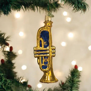 Trumpet ornament, gold with blue enamel, hanging on a Christmas tree