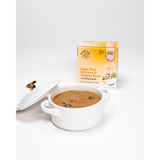 Cage-Free Chicken & Veggies Stew 11 oz in white dish beside dog food box with superfoods