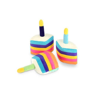 Dapper bone-appetit cake dog toy set of three with rainbow layered frosting and candles