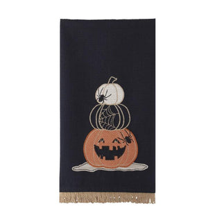 Tea towel with three stacked pumpkins jack-o'-lanterns on black background, fringed bottom.