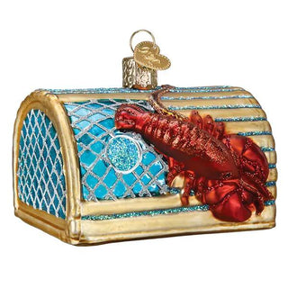 Lobster trap ornament with blue netting, gold trim, and red lobster on top.