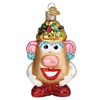 Mrs. Potato Head ornament with gold hat adorned with holly, blue eyelashes, pink ears, and red glitter shoes.