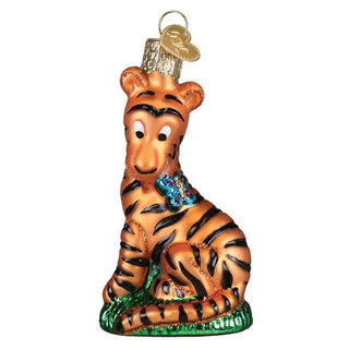 Tigger ornament, orange tiger with black stripes sitting on a green base, glass hanging ornament