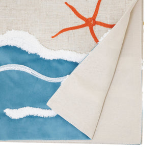 Beach table runner with beige canvas base and blue wave print with orange starfish motif