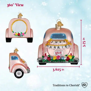 Just Married Magic Ornament, pink car-shaped ornament with Just Married banner, love sign, and colorful floral accents.