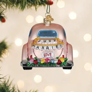 Just Married Magic Ornament: pink car with Just Married banner and flower bouquet