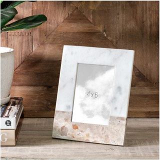 Beige marble photo frame for 4x6 photos, set on a wooden backdrop