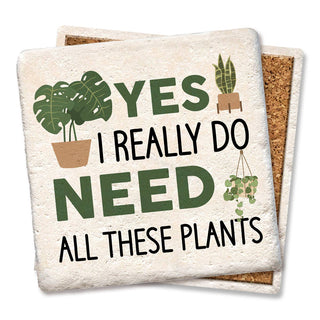 Set of two cork-backed coasters with a plant-themed design and the text Yes I really do need all these plants