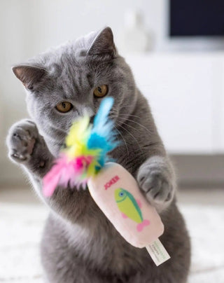 Meowjong Tiles catnip toy with feathers, pink plush tile and multicolor feather tassels; cat playing