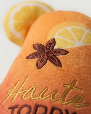 Haute Toddy holiday squeaker dog toy, orange plush with lemon slice pattern and embroidered star anise