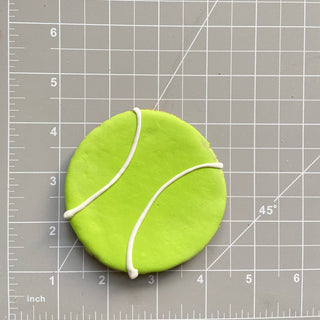 All the Dog Things dog cookie, lime green with white icing
