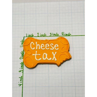 Snack Tariff Cookie bone-shaped orange cookie with white Cheese Tax text on graph paper