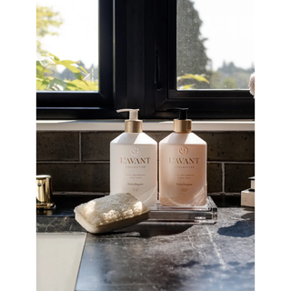 Two pump-dispensed dish soap bottles in white and blush pink with gold collars, Blushed Bergamot.