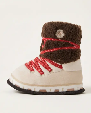 Apres Ski Boot squeaker dog toy with brown faux-fur cuff, beige body, red laces