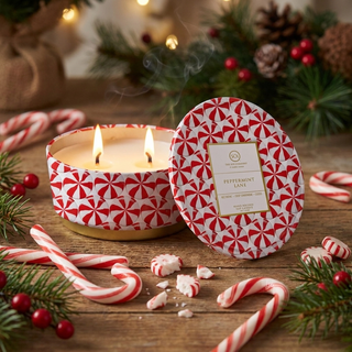 Peppermint Lane embossed Luxe 12oz tin candle, two wicks, red-and-white peppermint pattern with lid.