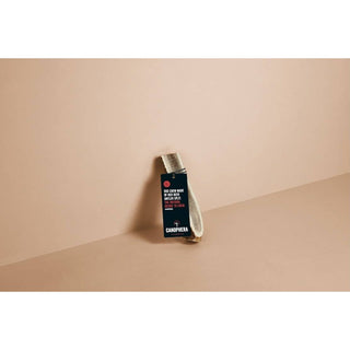 Dog chew made from red deer antler splits with brand label on a black tag