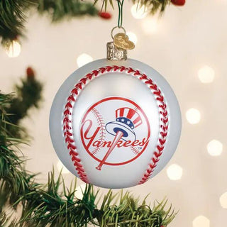 Yakees Baseball ornament with Yankees logo on a white ball, red stitching, hanging on a Christmas tree.