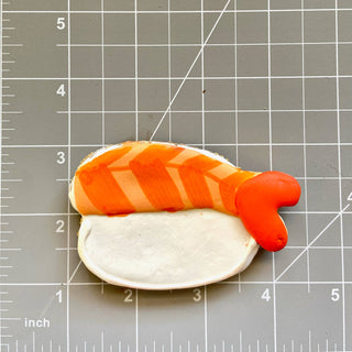 Lunch Menu dog treat cookie, hot-dog shape with orange icing stripes on a light bun