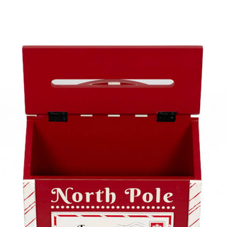 Red wooden mailbox-shaped Christmas decor with a North Pole sign