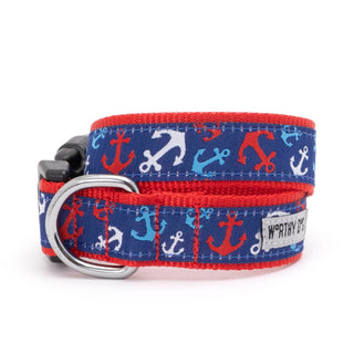 Anchors Ahoy dog collar in navy with red trim and multicolor anchor print; silver D-ring.