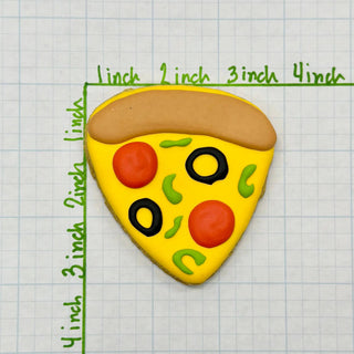 Lunch Menu cookie with yellow fondant base, red circles and green decorations on graph paper background.