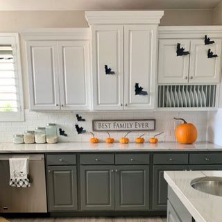 Black paper bats, 16 pcs, Halloween decor arranged on kitchen cabinets