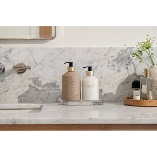 Hand lotion Ambre Santal, beige and white pump bottles on a marble vanity (2 bottles)