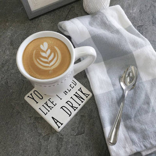 Coasters You Look Like I Need a Drink, white ceramic coasters with bold black lettering