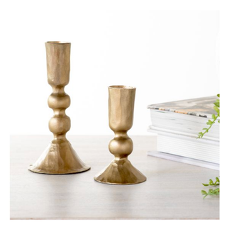 Antique gold ball candle holders, set of two, metal with varying heights.