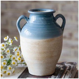 Small blue glazed terracotta vase with natural lower half and two handles.