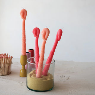 Flamingo-shaped taper candles, unscented peach color, set of 2 in a sand-filled glass holder