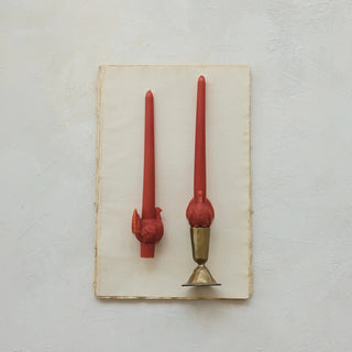 Taper candles with turkey motifs; two red unscented candles, one in a brass holder.